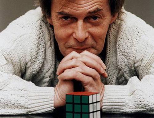 Erno Rubik with a rubik's cube